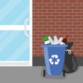 Overflowing trash can. Tank with debris and trash bags. Royalty Free Stock Photo