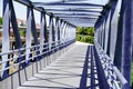 Overground Pedestrian Metal Crossing bridge walkway Modern steel building perspective Royalty Free Stock Photo