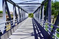 Overground Pedestrian Metal Crossing steel bridge walkway with Modern building perspective Royalty Free Stock Photo