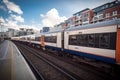 Overground Train passing by, at Imperial Wharf Station Royalty Free Stock Photo