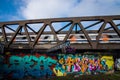 An overground train run fast while crossing a bridge Royalty Free Stock Photo