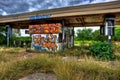 Overgrown Abandoned Gas Station Covered with Graffiti