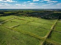 Overgrown natural sludge sumps for wastewater treatment, aerial view