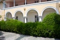 Overgrown old old abandoned mansion porch with columns Royalty Free Stock Photo