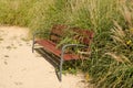 Overgrown park bench Royalty Free Stock Photo