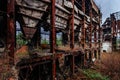 Overgrown ruins of industrial building. Abandoned, destroyed by war power plant in Tkvarcheli Tquarhcal, Abkhazia, Georgia Royalty Free Stock Photo