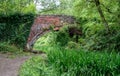 Overgrown 18th Century Whitehall Bridge over the disused Severn - Thames Canal near Frampton Mansell