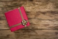 Overhaed shot of red gift box over wooden background