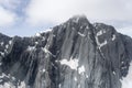 Overhanging dark rock scarp at Mt. Barth range, New Zealand