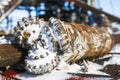 Overhaul of gas wells, oil rig platform drill bit close up teeth detail