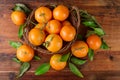 Overhead of basket with fresh mandarins tangerines fruits