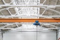 Overhead beam or bridge crane in industrial warehouse hangar building Royalty Free Stock Photo