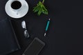 Black coffee, flora, pen, spectacles, mobile phone and organizer on black background Royalty Free Stock Photo