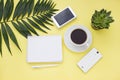 Overhead business frame with a solar battery, phone and cup of coffee. Top view