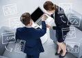 Overhead of business man and woman with white business doodles