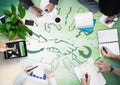 Overhead of business team with green wood panel and arrow with handshake doodles