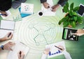 Overhead of business team with green wood panel and business doodle