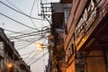 Overhead cables create a rats maze