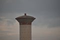 Overhead cement concrete storage tank which supplies water to the rural living people. with the background of sky