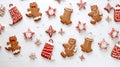 Overhead of Christmas New Year holiday background. Red gingerbread cookies boots, meetens, bag with gift, fir branch tree on white Royalty Free Stock Photo