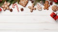 Overhead of Christmas New Year holiday background. Red gingerbread cookies boots, meetens, bag with gift, fir branch tree on white Royalty Free Stock Photo