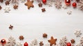 Overhead of Christmas New Year holiday background. Red gingerbread cookies, nuts and fir branch tree on white wooden table. Top Royalty Free Stock Photo