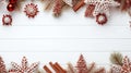 Overhead of Christmas New Year holiday background. Red gingerbread cookies, nuts and fir branch tree on white wooden table. Top Royalty Free Stock Photo