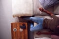 Overhead Close Up Of View Of Man Relaxing On Sofa At Home Watching TV