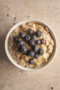 Overhead Closeup of a Bowl of Porridge with Blueberries on Top