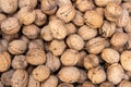 Overhead closeup shot of a huge pile of walnuts displayed under the sun