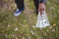 Overhead closeup shot of a male holding twenty dollar bills wit ha blurred background Royalty Free Stock Photo