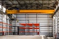 Overhead crane in a empty industrial warehouse building