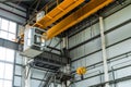 Overhead crane with hook in engineering plant shop
