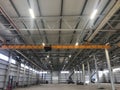 Overhead crane inside industrial building. Bridge crane inside hangar