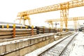 Overhead cranes over railroad in outdoor warehouse Royalty Free Stock Photo