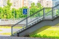 Overhead crossing staircase to bridge and sign in a residential area of the city