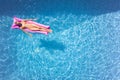 Overhead Drone Shot Of Woman On Summer Holiday Floating On Inflatable Airbed In Swimming Pool 