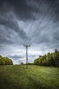 Overhead electric cables on wooden poles