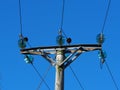 Overhead electrical power lines with glass insulator discs Royalty Free Stock Photo