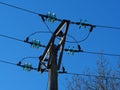 Overhead electric power lines with glass insulators Royalty Free Stock Photo