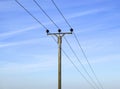 Overhead electricity cable and pole Royalty Free Stock Photo