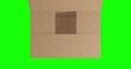 Overhead of empty brown cardboard box with lid opening on green screen background Royalty Free Stock Photo