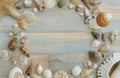 Overhead Flat Lay Background Frame of Seashells on Blue Weathered Wood Royalty Free Stock Photo