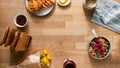 Overhead Flat Lay Shot Of Table Laid For Breakfast With Toast Cereal Croissant Pastries And Flowers Royalty Free Stock Photo