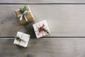 Overhead flat lay of three pretty Christmas gifts