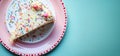 Overhead flat lay view of a slice of birthday party celebration cake