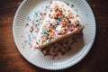 Overhead flat lay view of a slice of birthday party celebration cake