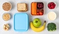 Overhead Flatlay of Healthy Lunchbox with Fruits and Vegetables on White Table Royalty Free Stock Photo