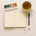 Overhead Flatlay of Open Notebook with Watercolor and Tea Still Life, generative AI Royalty Free Stock Photo