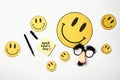 Overhead glasses with mustache , and yellow smiles April 1, joke, fools day, top view, close-up Royalty Free Stock Photo